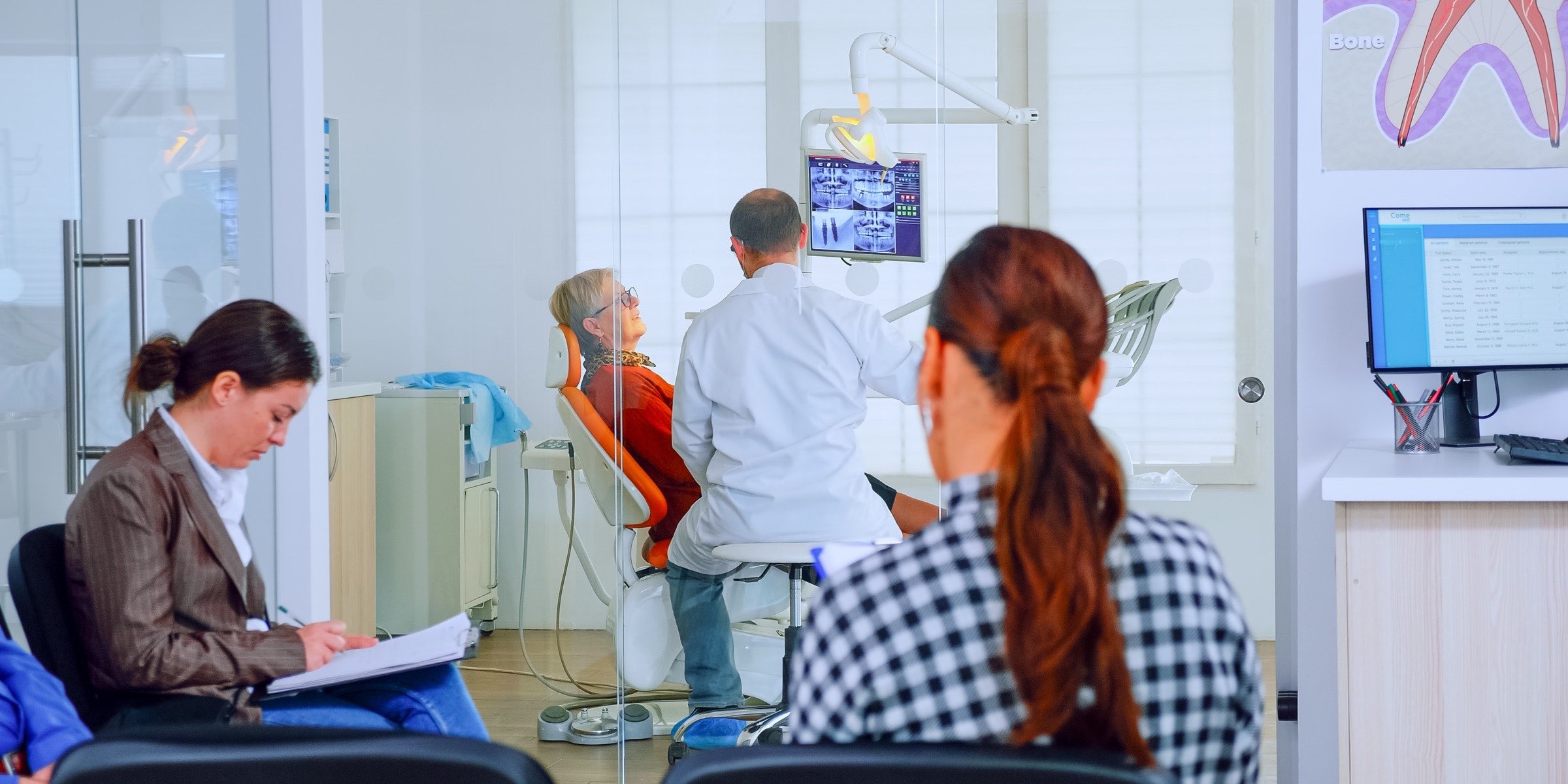 A clinician and a patient mid-conversation during a visit