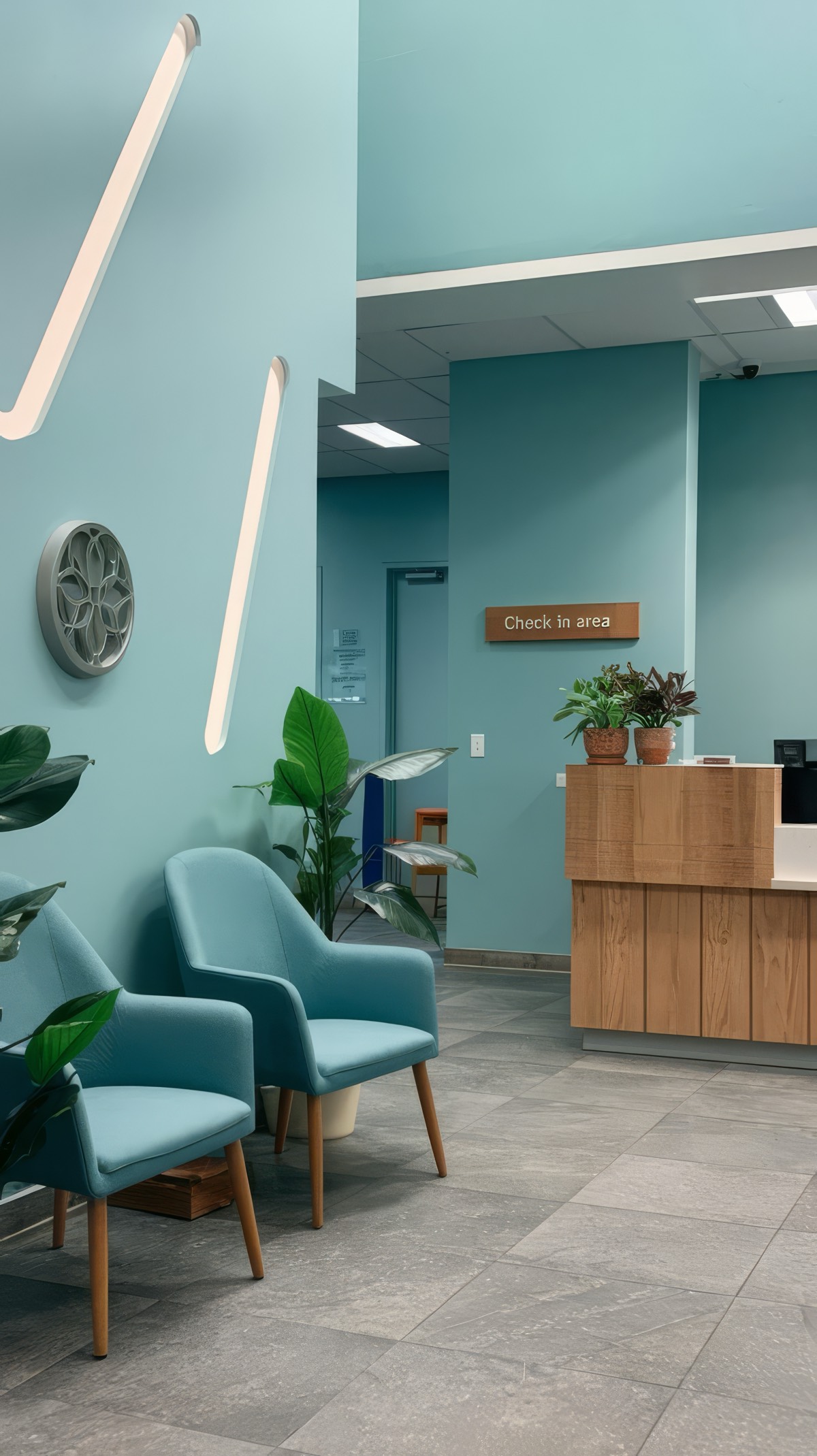 A front-desk team member smiling at the clinic in the morning